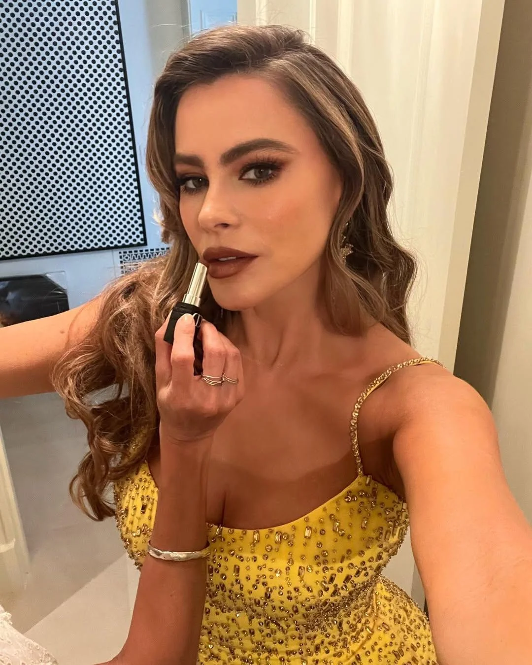 Sofia Vergara, 50 putting on her Lipstick for the 2022 Emmy Awards picture 2 of 2